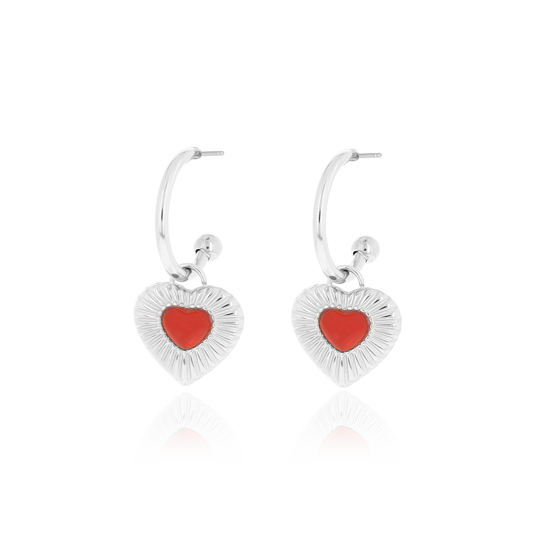 Silver coloured earrings with red heart charm